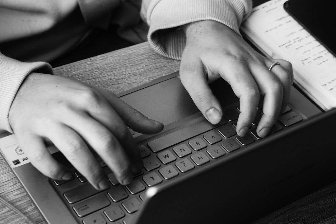 student writing desk laptop
