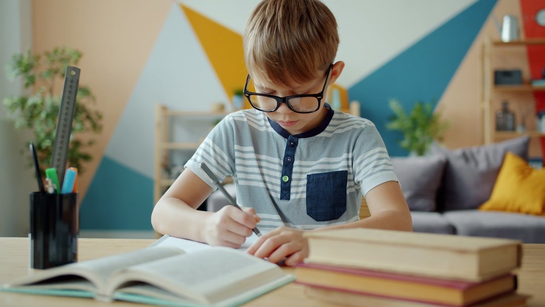 student writing at desk