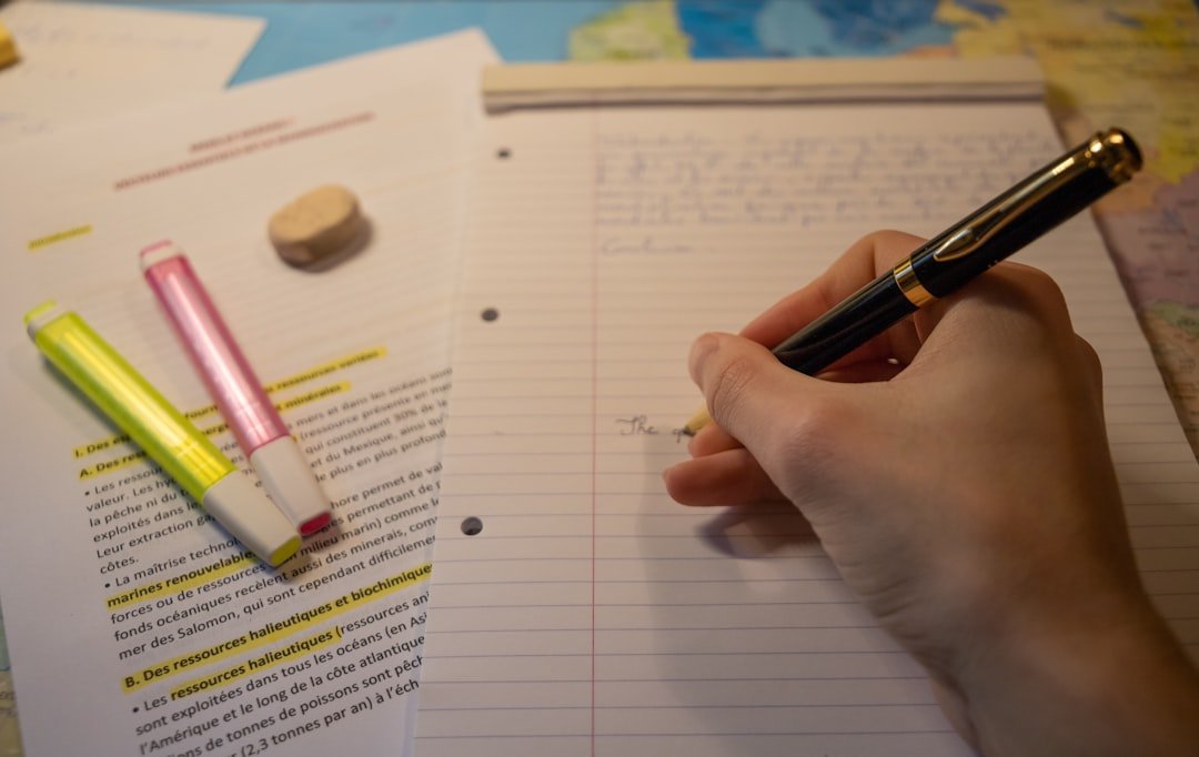 student writing essay notebook