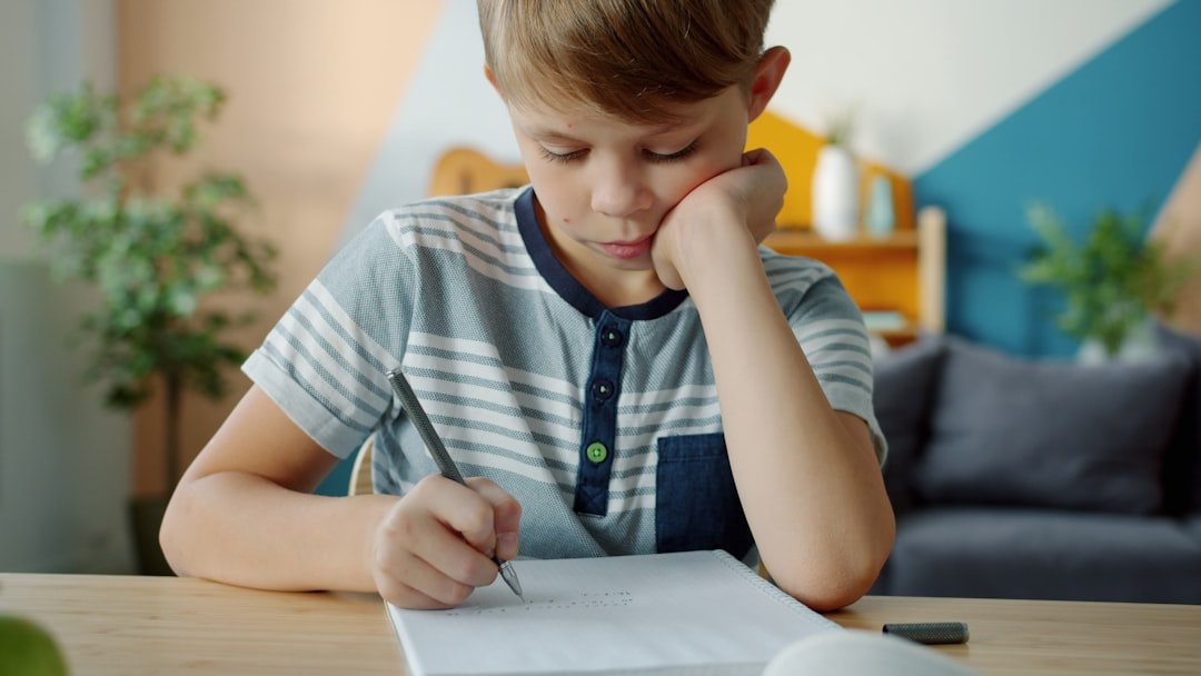 student writing at desk