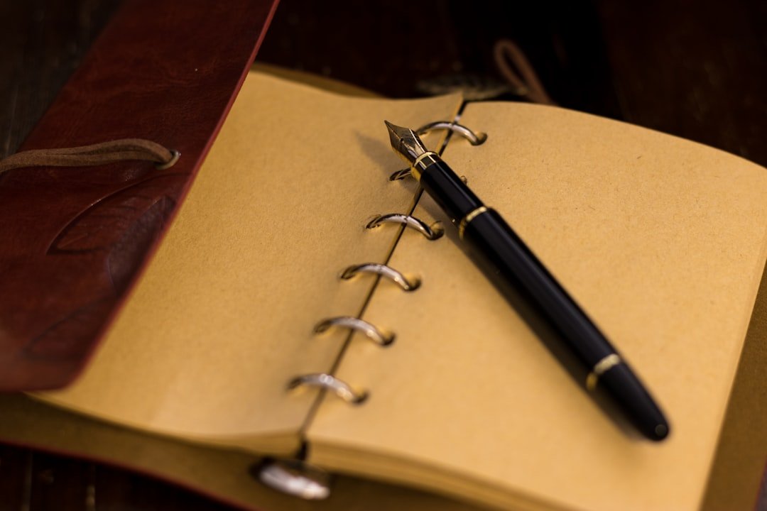 open book with pen notebook
