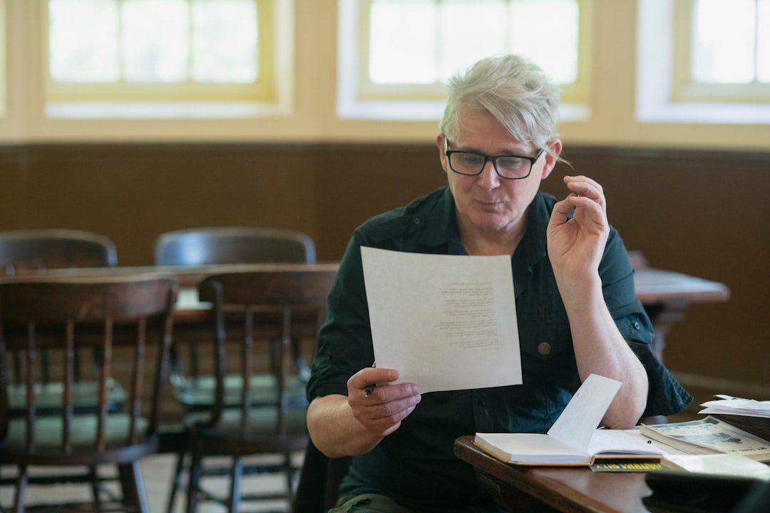 professor grading student essay paper