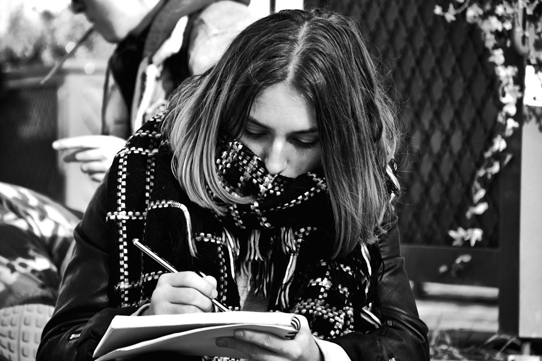 student writing notebook