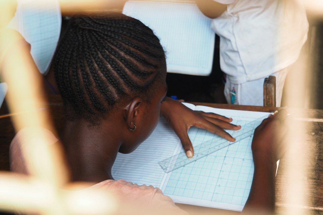 teacher reviewing student essay