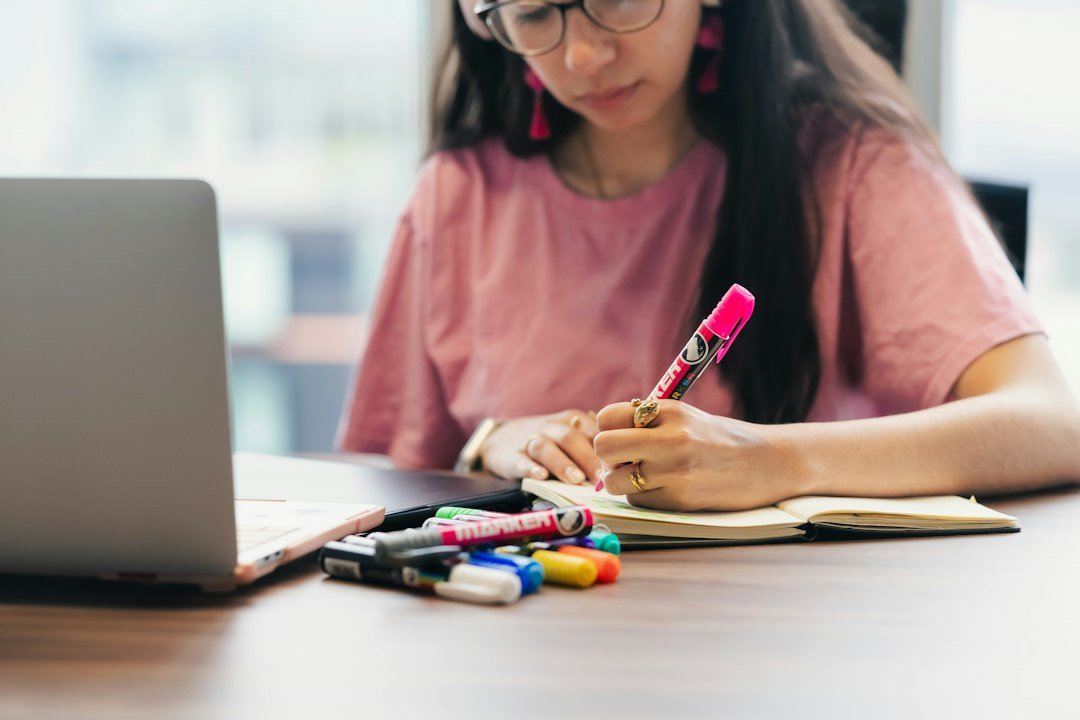 student writing essay at desk